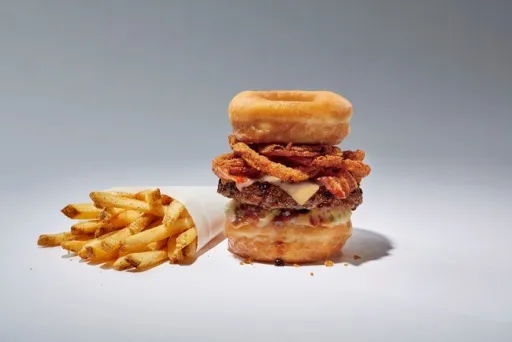 Image for article TGI Friday’s New Bacon Burgers Are Sandwiched by Krispy Kreme Doughnuts!