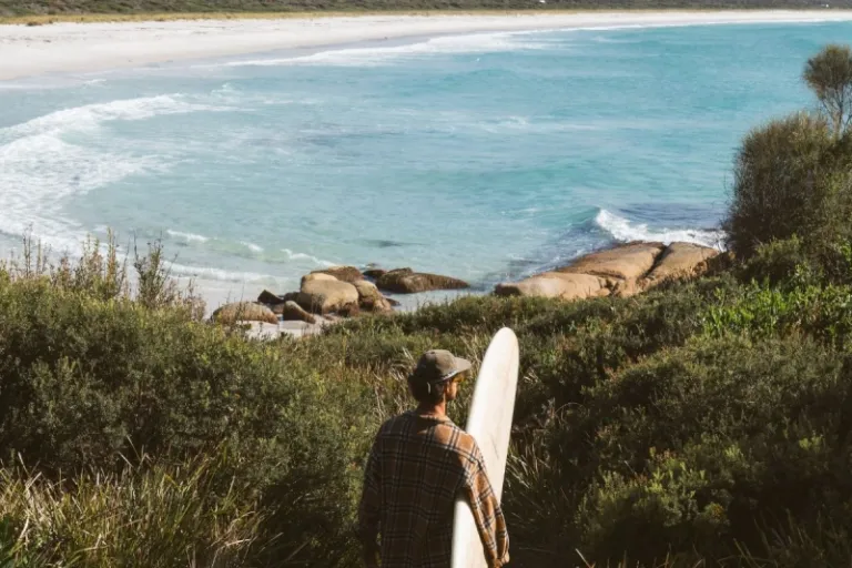 surfer in Bay of fires, Tasmania