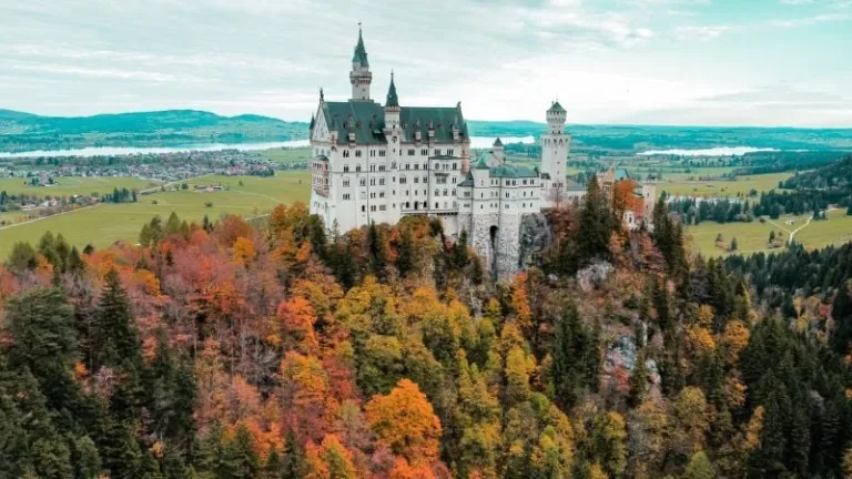 castle in Bavaria surrounded by autumn foliage