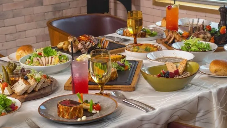 spread of dishes and drinks at a high end restaurant