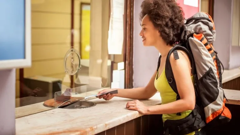 tourist buying a ticket