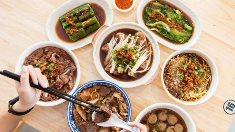 bowls of noodle and vegetables