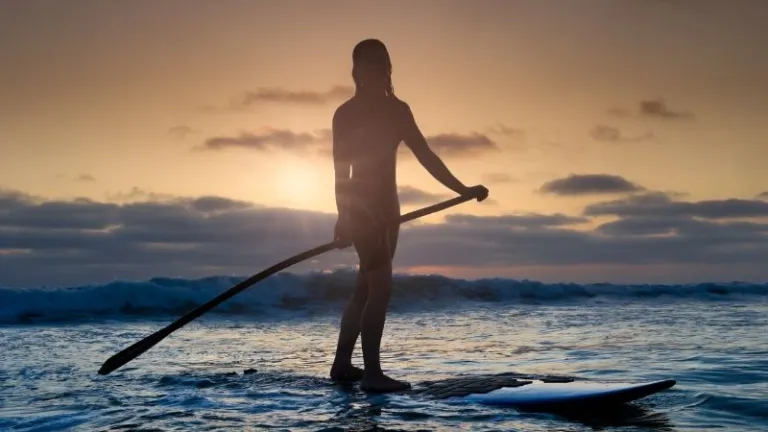 paddleboarding at sea