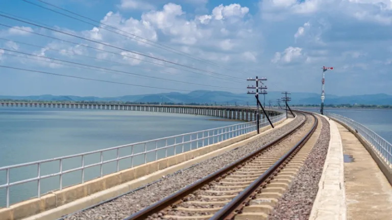 train tracks in the middle of the dam