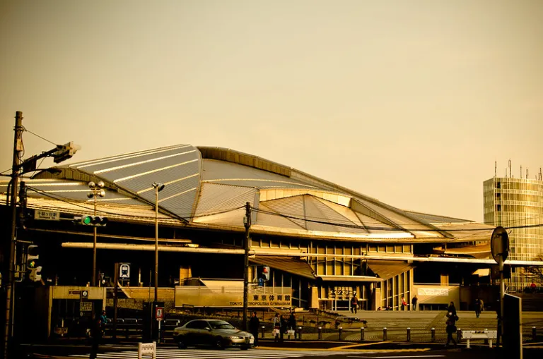 Exterior view of Tokyo Metropolitan Gymnasium with its distinctive curved roof, Tokyo, Japan
