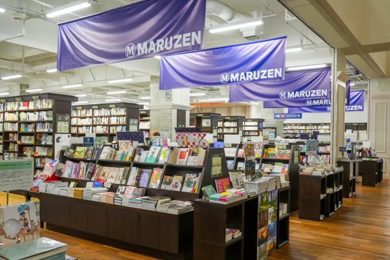 Interior of Maruzen Kyoto featuring neatly arranged bookshelves and a wide selection of books.