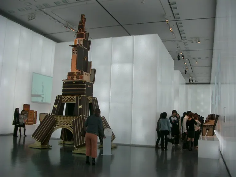 Visitors exploring contemporary art exhibitions inside Hyogo Prefectural Museum of Art, designed by Tadao Ando.