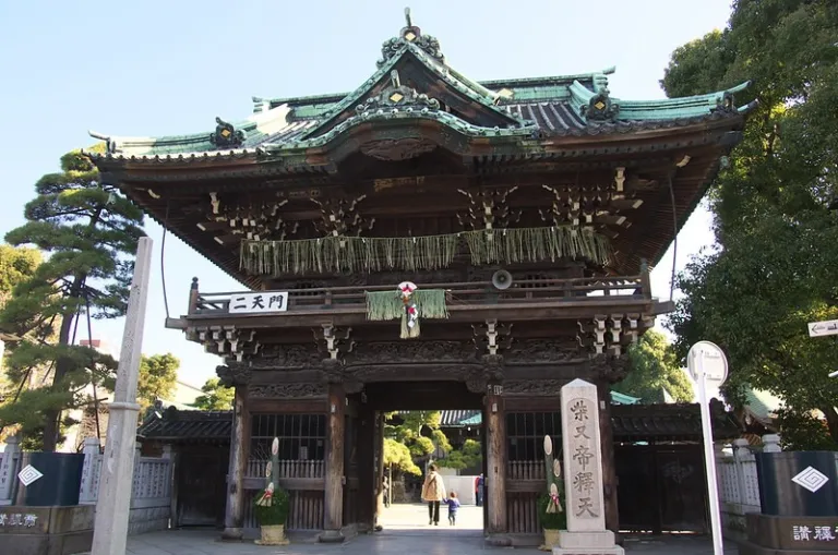 Wooden gate of Shibamata Taishakuten Temple in Tokyo, showcasing traditional temple architecture at the entrance.