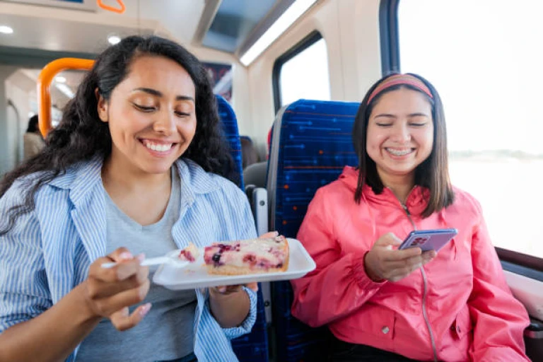 Snack-sharing camaraderie on Indian train rides! 