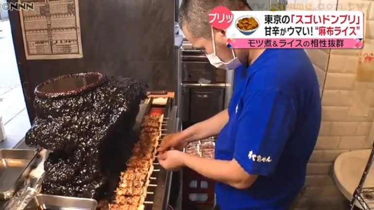 Making Pork Skewers at Abe Chan Japanese Restaurant